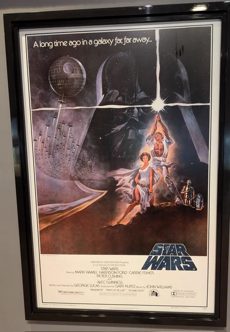 Original movie poster for star wars including a list of starring actors 