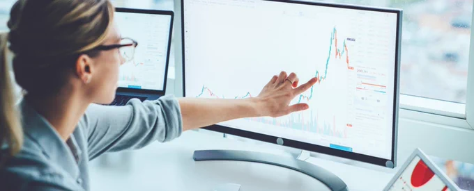 Person looking at a screen with data on it.