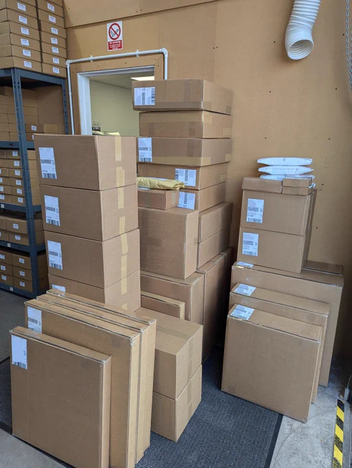 A pile of boxes stacked together awaiting collection.