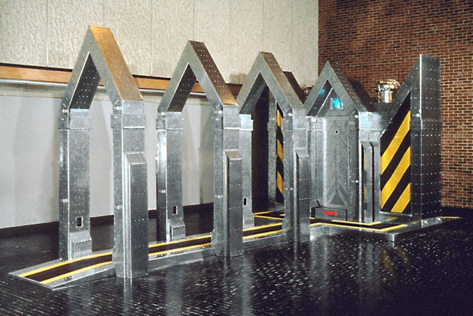 Artwork / Michael Aurbach, The Confessional (1994), Mixed Media 10.5’ x 12’ x 36’