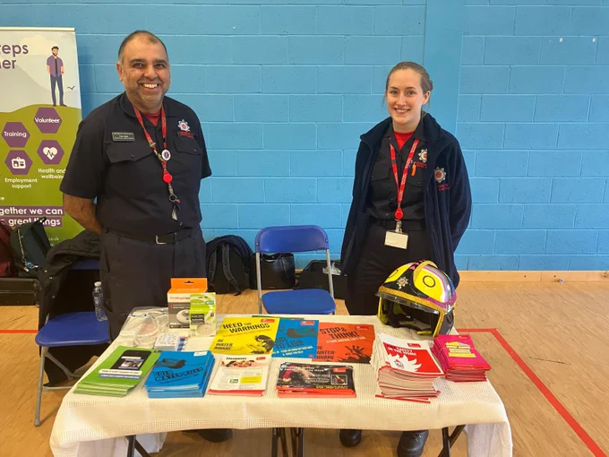 CFS team members at a college stand promoting prevention information.
