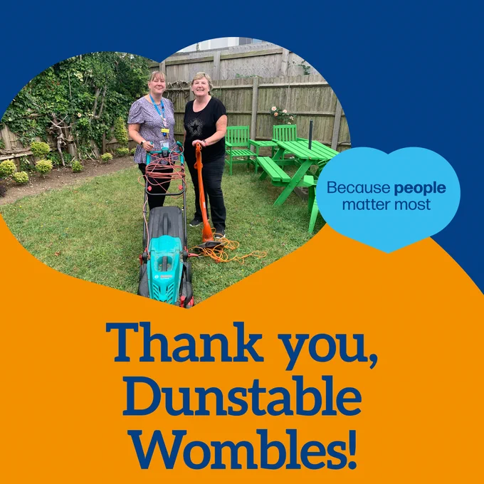 Photo of Charmaine and lady form Dunstable Wombles with lawn mower and strimmer with the text 'Thank you, Dunstable Wombles!'