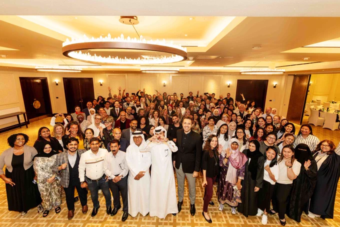 Group photo of the faculty and staff at the assembly