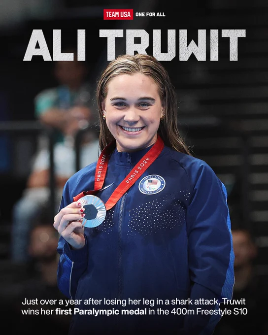 Photo of Ali Truwit and her silver medal with text just over a year after losing her leg in a shark attack, Truwit wins her first Paralympic medal in the 400m Freestyle S10.