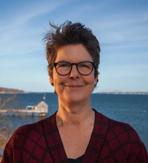 a photo of Dr. Karen Kent with the ocean in the background