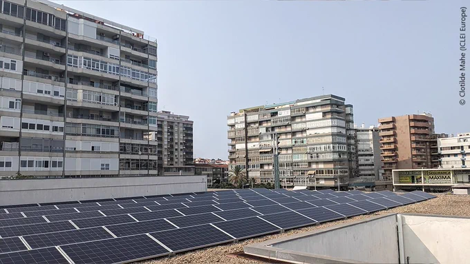 Roof of building with solar panels in a poor neighbourhood.
