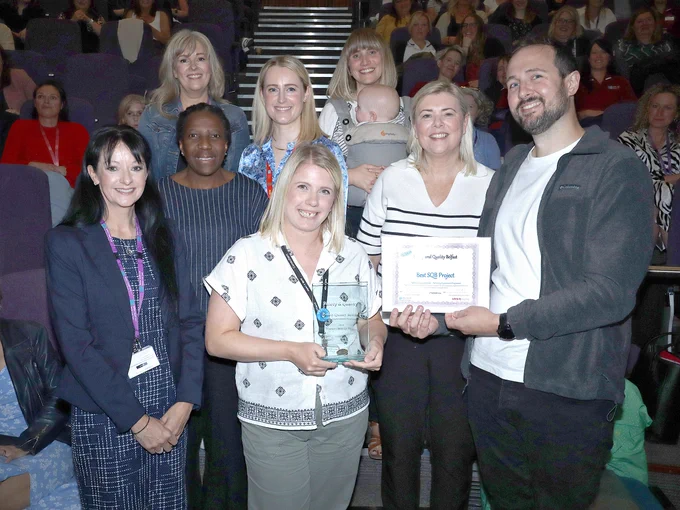 Group of staff with their Best SQB Project award