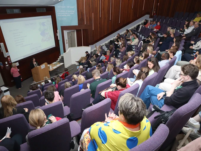 Staff gathered at the lecture theatre for the presentations at the Safety Quality Belfast celebration event. 