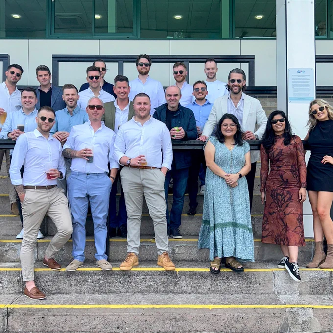 A group photo of the Delio team at Chepstow Racecourse.