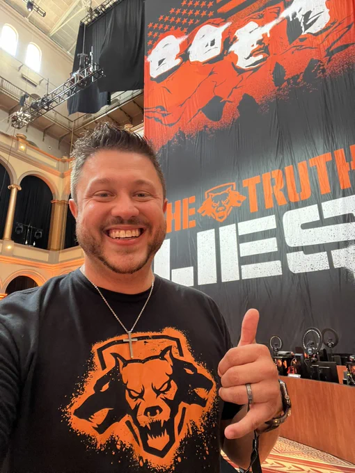 Dex standing in front of a Black Ops 5 background with text that reads “The Truth Lies” at Call of Duty: NEXT.