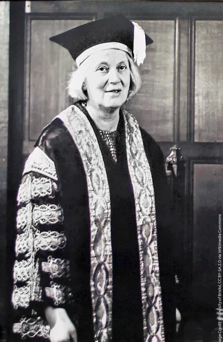 Dorothy Crowfoot Hodgkin wearing academic regalia, including a robe and mortarboard.
