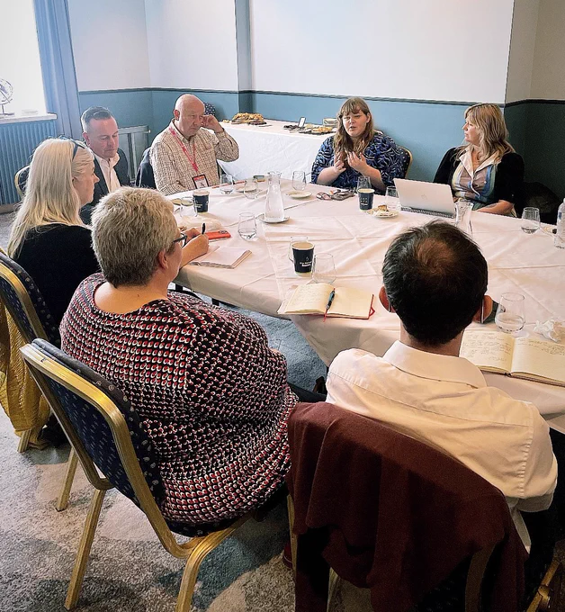 Me speaking with a group of social care experts