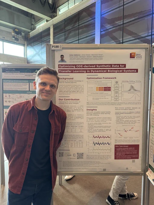 Julian Zabbarov smiling proudly in front of his poster titled "Optimizing ODE-derived Synthetic Data for Transfer Learning in Dynamical Biological Systems".