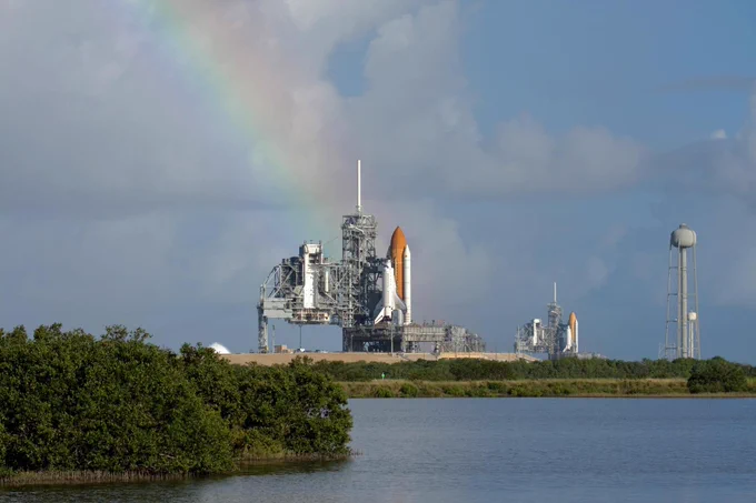 A rainbow completes this unique panorama of two space shuttles on the launch pads at the same time on Sept. 20, 2008. (Credit: NASA)