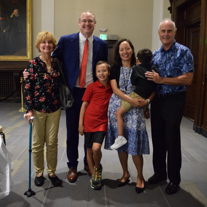 Dr. Eva Tseng poses for a group photo with her family at her promotion celebration.