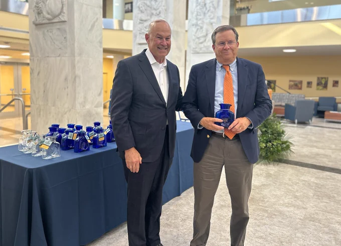 Dr. Marc Haut is presented his award from Dr. Clay Marsh.