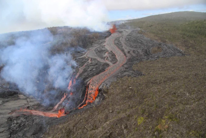 USGS Hawaiian Volcano Observatory geologists conducted a reconnaissance overflight of the eruption near Nāpau Crater on the middle East Rift Zone of Kīlauea. They observed lava cascading over the rim of the crater from a channel more than 50 meters (about 164 feet) wide. Lava is contained within Nāpau Crater and now covers about two thirds of the crater floor. USGS photo taken Sep 19, 2024, by M. Zoeller.