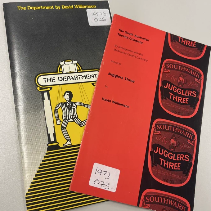 Black booklet with a puppet on it and the title 'The Department'. A red booklet with a beer label that says 'Jugglers Three'