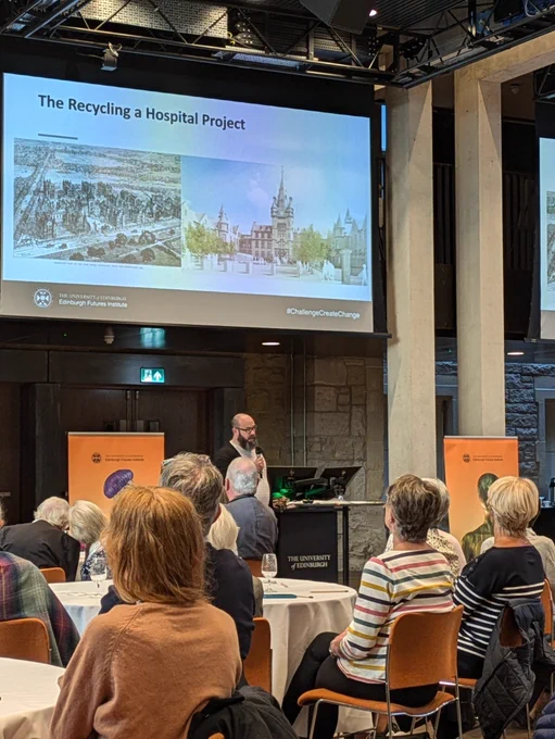 Jimmy Turner speaking to the audience about the origins of the Recycling a Hospital project.