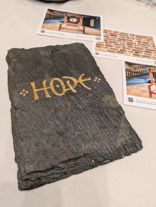 One of the original slate tiles from the hospital roof, with 'hope' engraved on it. 