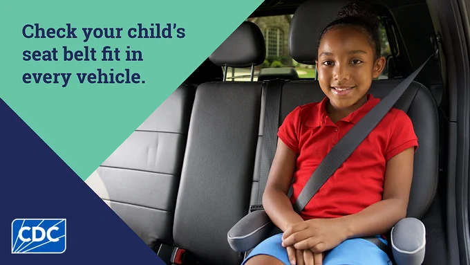 A young child siting in a booster seat with her seat belt on correctly with text overlay “Check your child’s seat belt fit in every vehicle.”