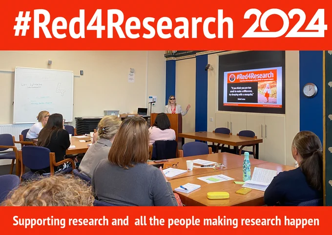 Lady wearing red with a white jacket presenting to a group of people. Text saying #Red4Research supporting all the people making research happen