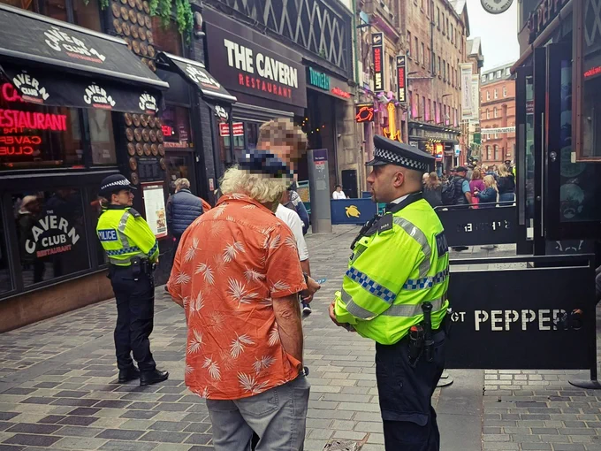 Project Servator officers at Mathew Street, Liverpool, engaging with members of the public.