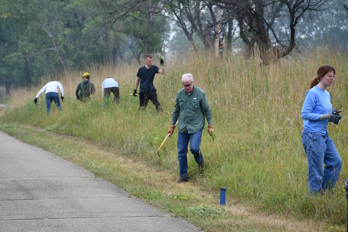 Volunteers working along a trail.