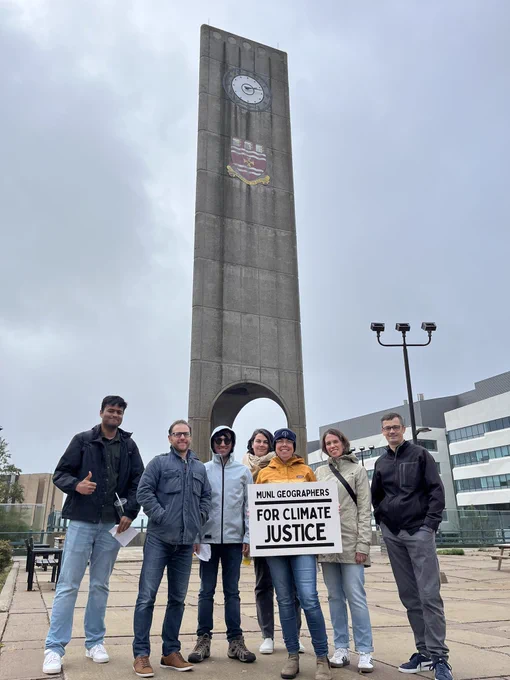 MUN Geographers pose in front of the clock tower before the climate march.