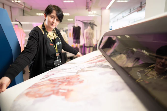 female technician working with fabric