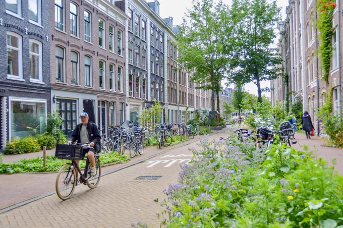 Man cycling in de Pijp, a neighbourhood in Amsterdam