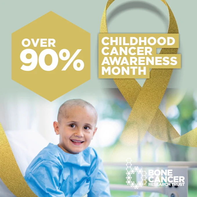An image of a child wearing a patient gown in a hospital. A yellow ribbon has been edited next to him and reads, "Childhood Cancer Awareness Month". Next to this text is a yellow hexagon with the number over 90%.
