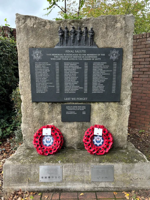 Firefighter memorial with poppy reefs laid on it