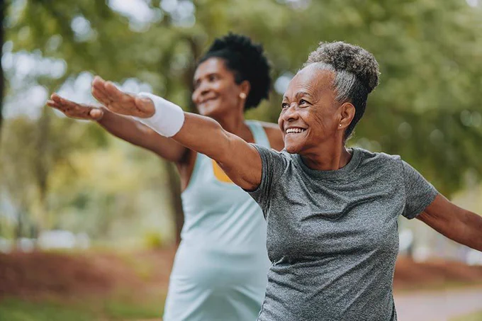 Older adults exercising outdoors