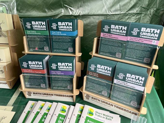 The tree trail paper maps in custom made stands on the stall at the event, ready to be collected.