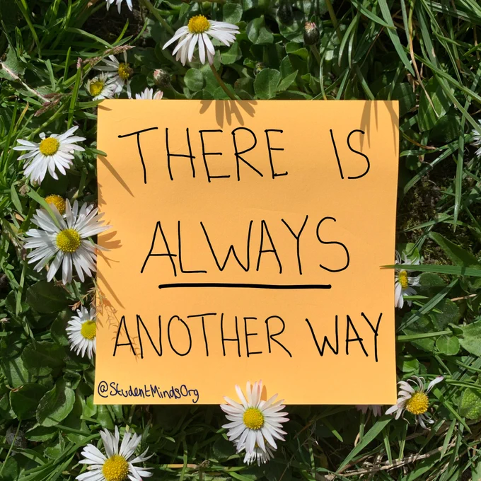 Yellow post-it note on top of some grass and and whit flowers. On the post-it note it reads: There always another way. This is in all capitals with the always underlined. In the bottom left of the post-it note it also reads @studentmindsorg 