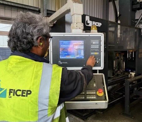 A Ficep engineer is demonstrating the Ficep machine interface.