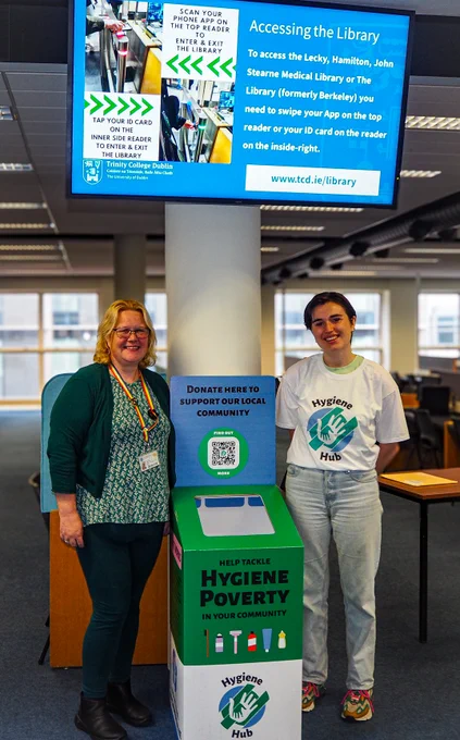 Science Librarian Jessica Eustace-Cooke with Sorcha Killian of Hygiene Hub standing with the drop off box in the Hamilton Library. 