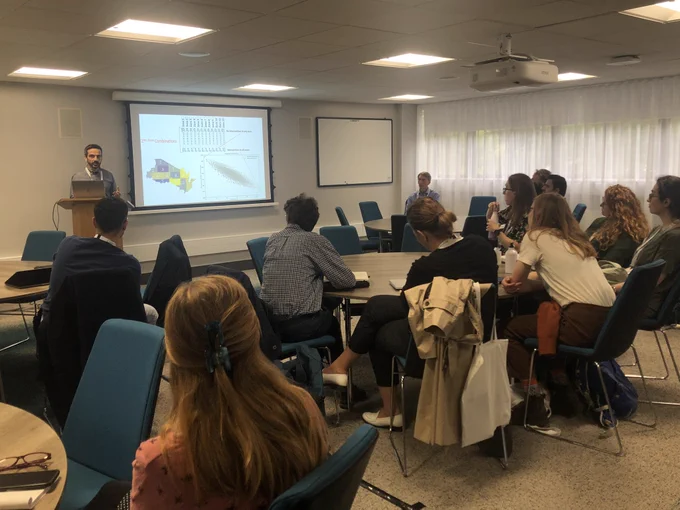 Group of people listening to a presentation