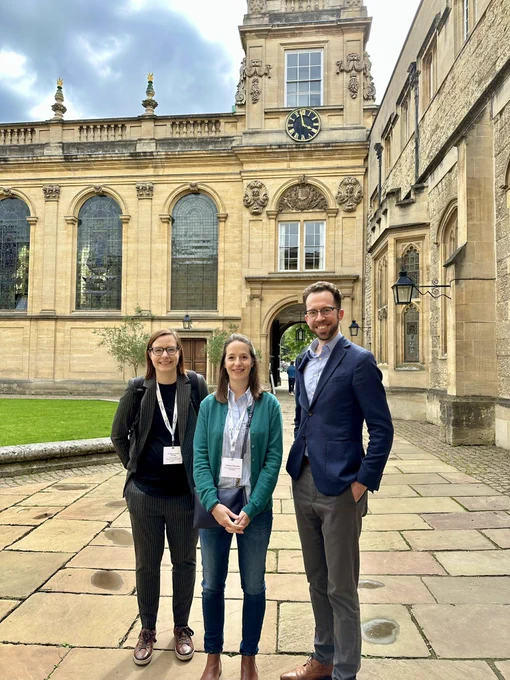 A photo of Janine George, Nadine Schneider, and Volker Deringer at Trinity College, Oxford