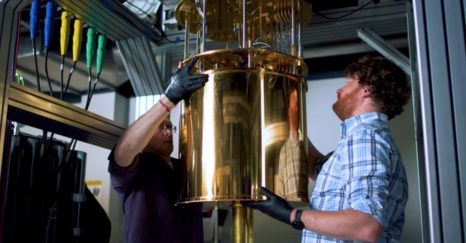 Two researchers working on a quantum machine.