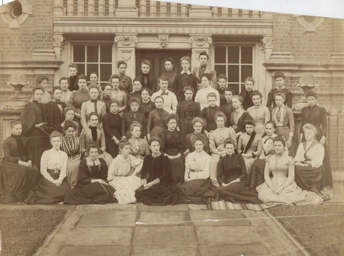 RHC PH.206.1 Student group summer 1890, a sepia photo of students posing outside of the building