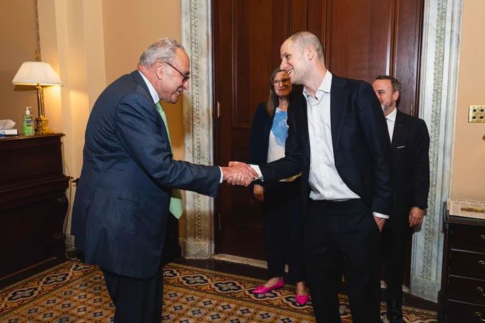 Senator Schumer shakes hands with Evan Gershkovich in the U.S. Capitol, September 10, 2024.