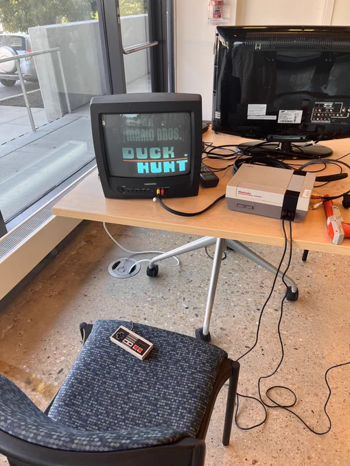 A setup of Duck Hunt video game on a NES system