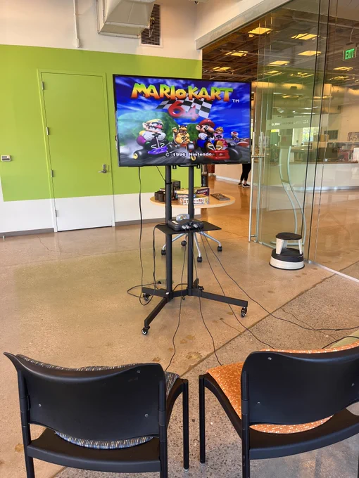 A setup of Mario Kart 64 video game on a Nintendo 64 system