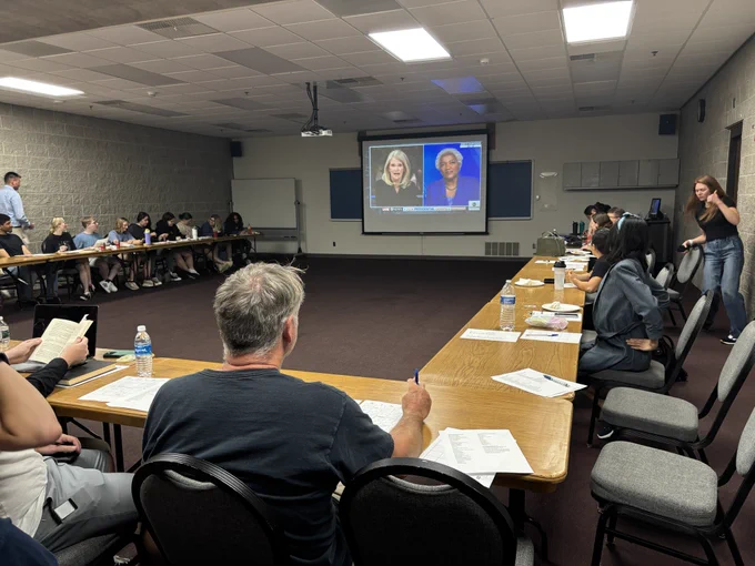 A group of people gathered to watch the presidential debate at UIS.
