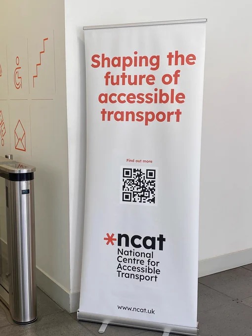 Ncat banner with a qr code reading ‘Shape the future of accessible transport’ with the Ncat logo and website address underneath 