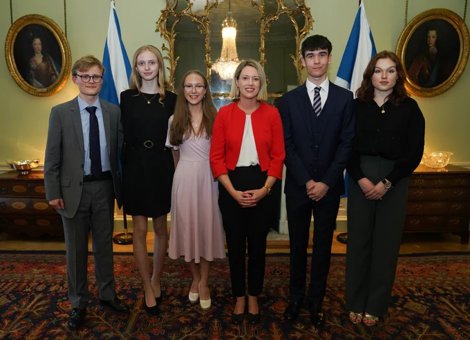 Education Secretary Jenny Gilruth pictured alongside the World Schools Debating Championship winners from Scotland