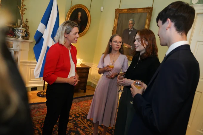 Education Secretary Jenny Gilruth speaks with the World Schools Debating Championship winners from Scotland