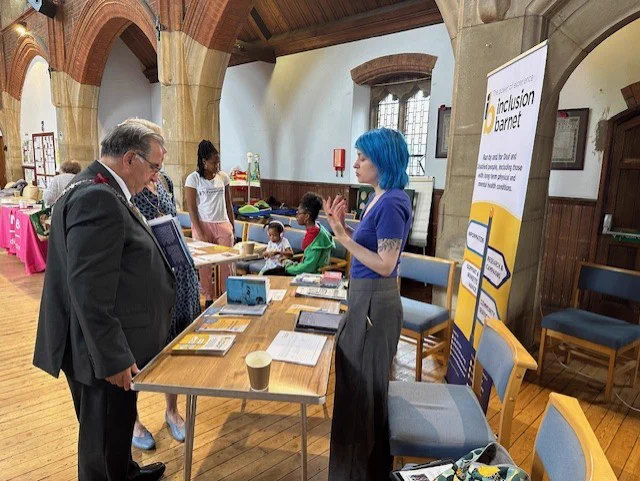 Our User Voice Engagement Officer, Eve, talking to the Mayor of Barnet, Councillor Tony Vourou.